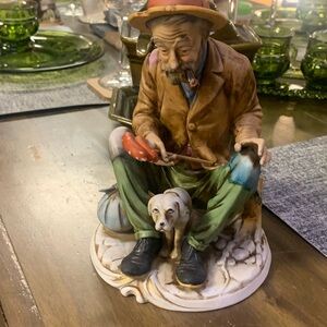 Charming Figurine of a Man with Dog